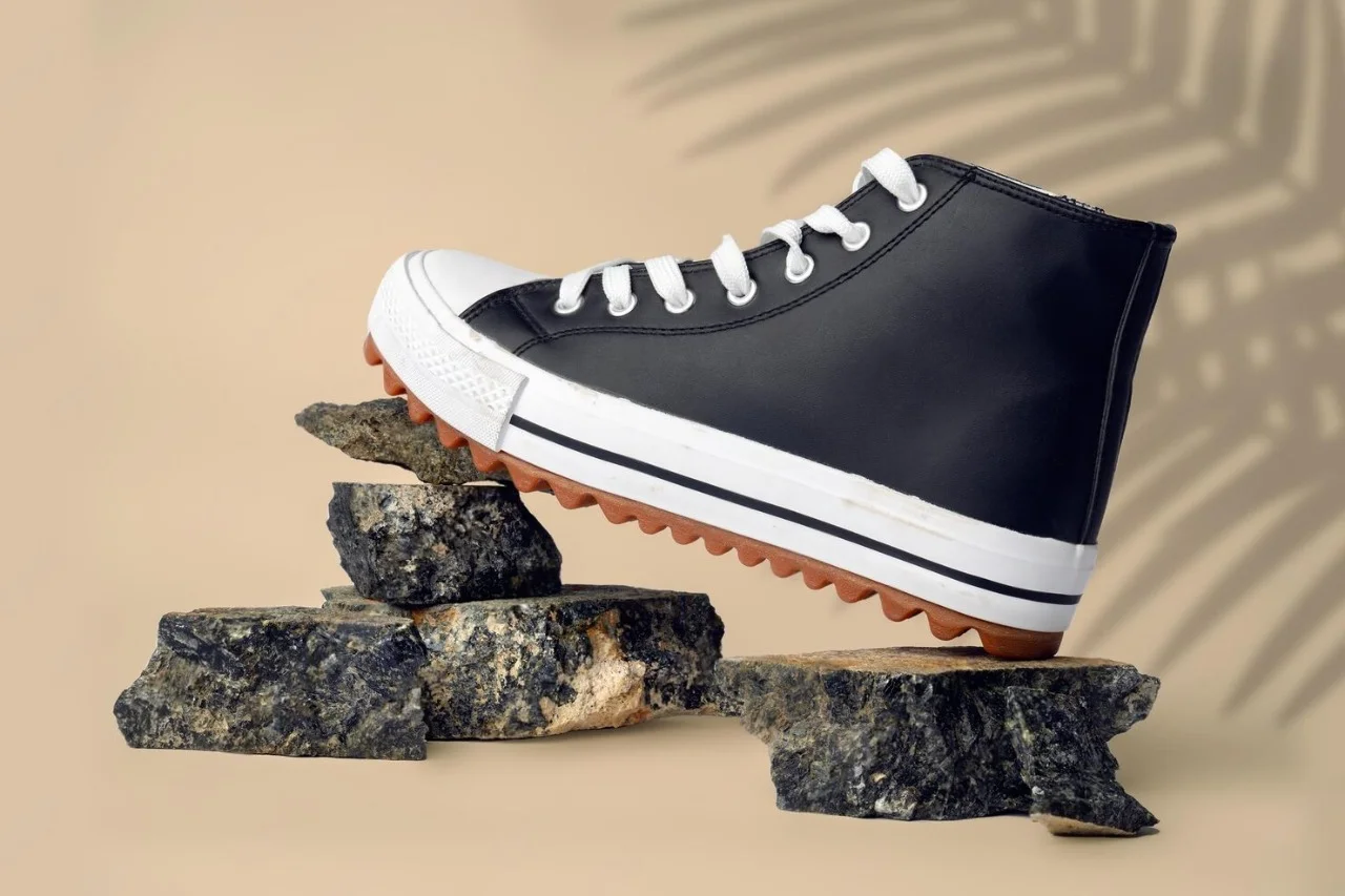 new-sneaker-shoe-stones-beige-studio-background_93675-153014